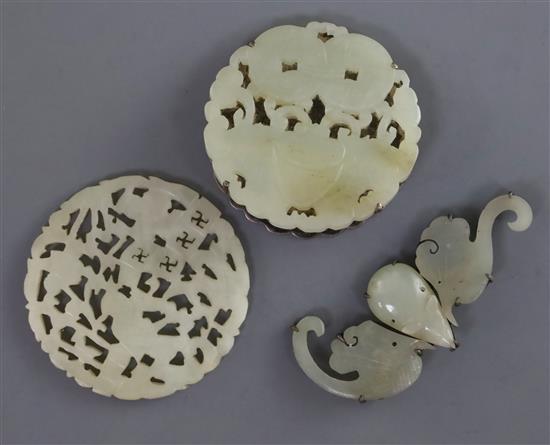 Two Chinese pale celadon jade plaques and a hair ornament, 19th century, 5.4cm - 7cm (3)